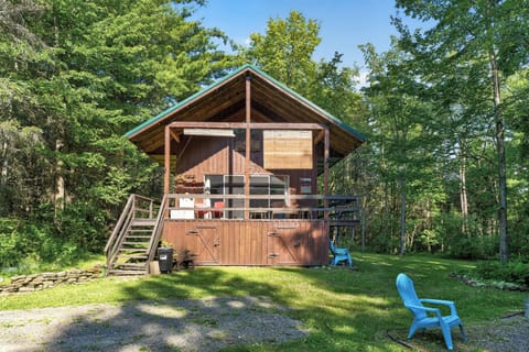 Wood cabin surrounded by mature trees