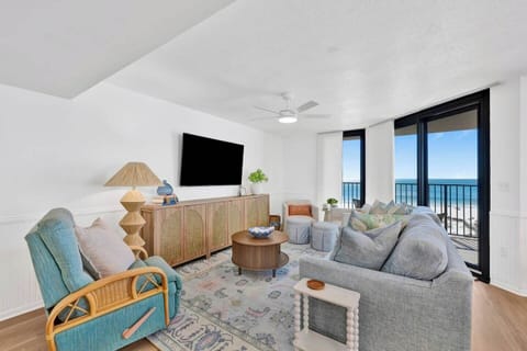 The living room has a queen sofa sleeper, smart tv, and beachfront views.