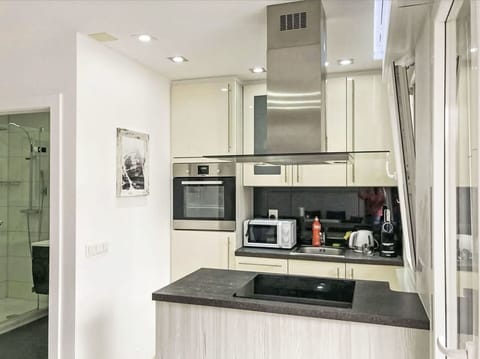 Kitchen, Kitchen Appliance, Countertop, Interior Design, Cabinetry, Furniture, Flooring, Major Appliance, Wood, Ceiling