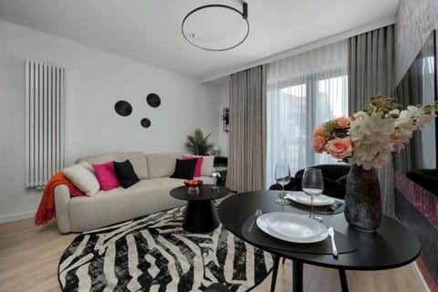 Relax in the stylish living room with a comfortable sofa and modern decor.