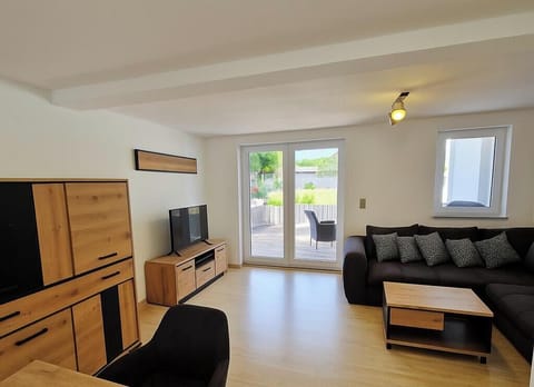 Comfort Apartment | Living area | Flat-screen TV