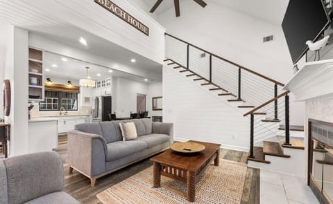 Living area; stairs to 4th bedroom