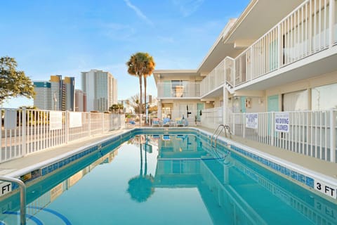 Shared outdoor pool with comfortable sun loungers for relaxing and soaking up the sun. No lifeguard on duty—children must be accompanied by an adult at all times.