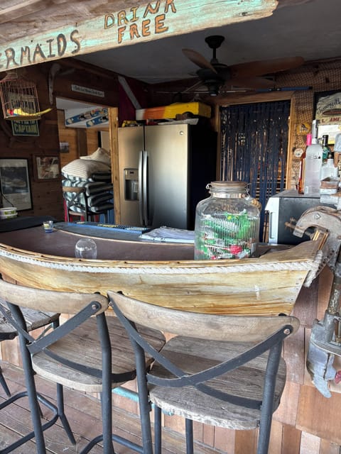 Bar with full sized fridge, ice maker, oven, sink