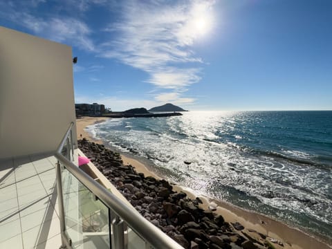 Oceanfront balcony with stunning sunrise and sea views