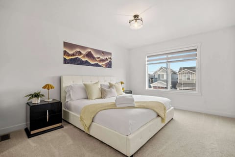 Spacious Primary Bedroom with Cozy King Bed and Full Ensuite with Walk-In Closet