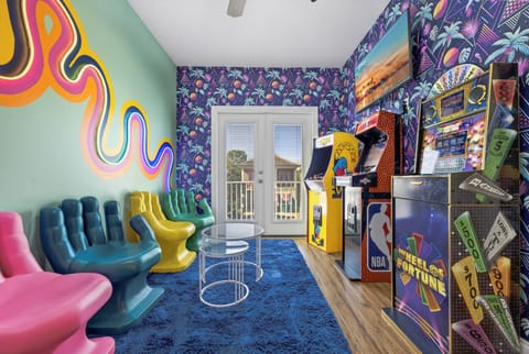 Upstairs loft area with Ms. Pac Man, NBA Jam, and Wheel of Fortune Arcades. 