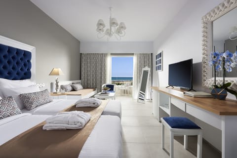 Deluxe Double Room, Partial Sea View | Minibar, in-room safe, iron/ironing board, free cribs/infant beds