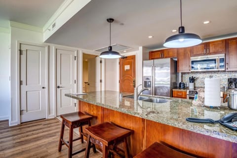 Cook, dine, and unwind in this open-concept oasis with tropical views HKH-211