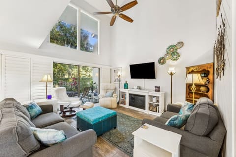 Natural light and ceiling fan make the room feel light and airy