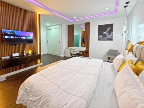 Luxury Apartment, Balcony, City View | In-room safe, desk, laptop workspace, blackout drapes