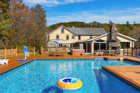 Dine, lounge, and unwind — the pool area offers multiple dining spaces and plenty of loungers for ultimate relaxation.