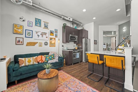 Open concept layout with bright seating, modern kitchen, and thoughtful design throughout