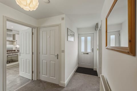 Clean, modern hallway giving a great first impression with downstairs WC