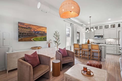 Living Area: A pristine, light-filled living room with cozy furnishings and a calm, welcoming ambiance.