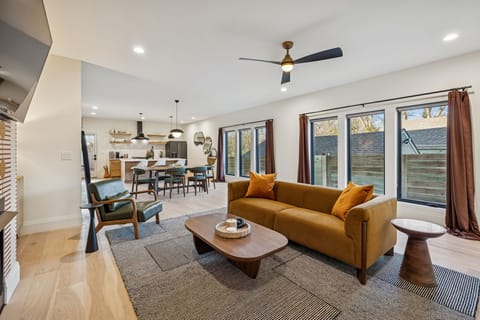 Living Room: Designed for groups who love comfort and convenience—this modern living room features a large smart TV, contemporary décor, and plenty of space to unwind together.