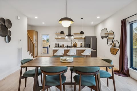 Dining Area: This isn't just a dining room; it's the perfect centerpiece for your whole crew.