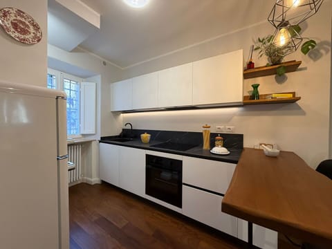 Countertop, Kitchen, Kitchen Appliance, Interior Design, Cabinetry, Furniture, Major Appliance, Flooring, Wood, Kitchen Stove