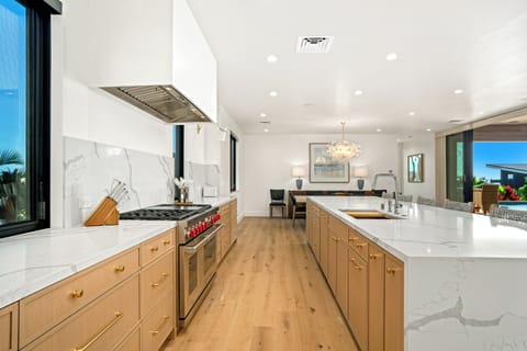 Your gourmet kitchen awaits with quartz countertops, high end appliances, and warm wood cabinets creating the perfect space for culinary adventures.
