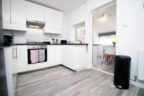 The fully equipped kitchen is ready for your culinary adventures, with everything you need to make delicious homemade meals. 