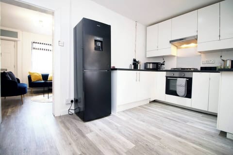 The fully equipped kitchen is ready for your culinary adventures, with everything you need to make delicious homemade meals. 