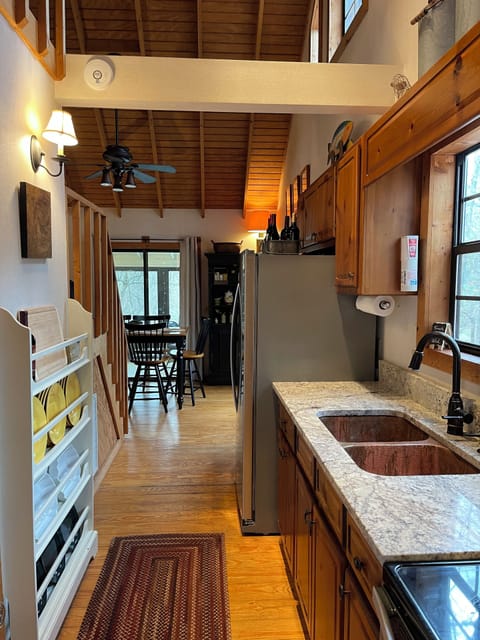 Galley kitchen with NO DISHWASHER; guests must handwash own dishes