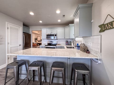 Spacious, modern kitchen with ample seating—perfect for cooking, gathering, and enjoying time together.