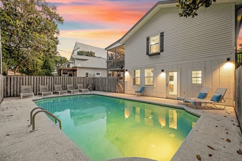 A private pool glows invitingly under a painted sky—your perfect spot for morning swims or evening relaxation after exploring the area.