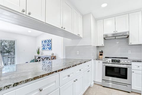Crisp white cabinetry paired with timeless finishes.