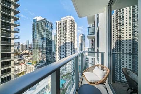 Private balcony with city skyline views.