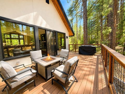 Main upper deck with gas fire pit in Spring