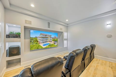 Sink into plush leather recliners and enjoy movie nights in your private theater room, complete with a massive screen and premium sound system for unforgettable entertainment.