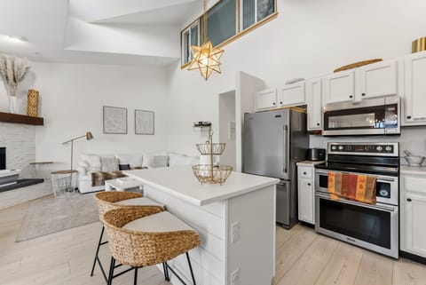 Step into your bright, open-concept sanctuary where modern kitchen meets cozy living space, complete with sleek appliances and stylish finishes for your perfect getaway.