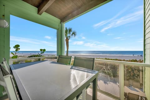 Covered balcony dining with ocean views