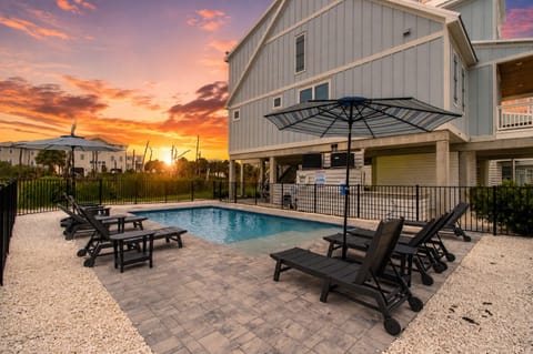 End your day poolside with glowing sunset skies, warm coastal breezes, and the perfect place to relax after a beach day.