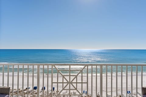 Emerald water and white sand just beyond your balcony.