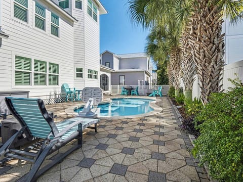 Your private pool oasis awaits with comfortable loungers and tropical palms, perfect for sunny afternoon relaxation.