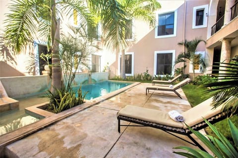 Linger in the warm sun with poolside loungers nearby.