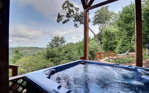 Hot tub with a view—mountains, relaxation, repeat