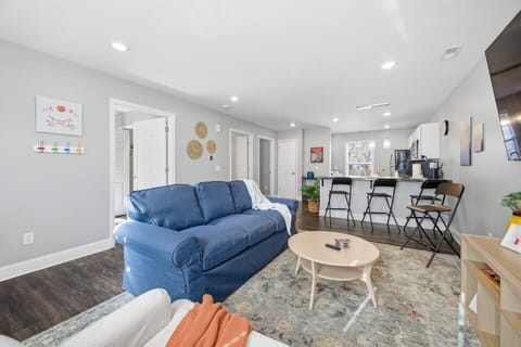 Sunny open-plan living with island seating and modern kitchen