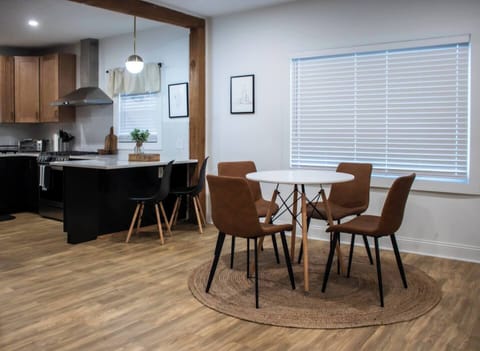 Inviting dining room w/ a wood table and chairs, perfect for shared meals and easy conversation