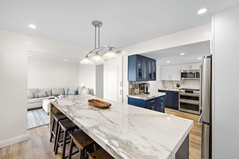 The dining room is conveniently located between the kitchen and living room—perfect for shared meals, entertaining, and easy conversation