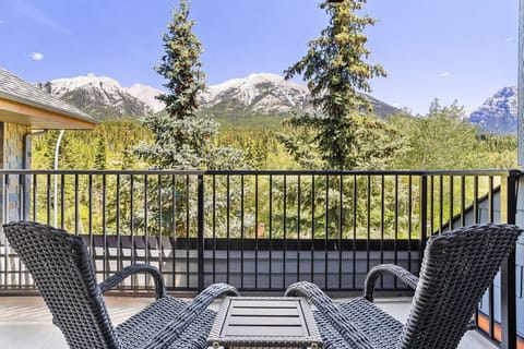 The balcony offers a breathtaking view of the majestic Rocky Mountains, creating the perfect spot to unwind, soak in the views, and experience the beauty of nature from the comfort of your home.