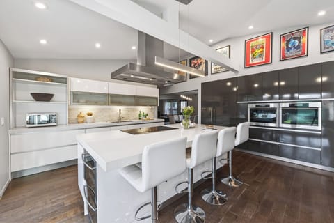 Bright, open kitchen designed for easy hosting, with seamless flow to indoor and outdoor gathering spaces.