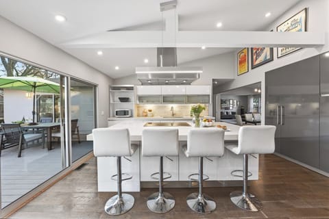 Bright, open kitchen designed for easy hosting, with seamless flow to indoor and outdoor gathering spaces.