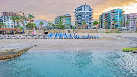 On the beach, sun loungers, beach umbrellas, beach towels