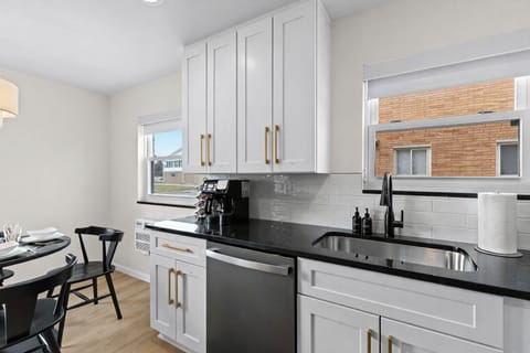 Bright kitchen with sleek countertops, modern cabinetry, and thoughtful details—perfect for cooking, coffee breaks, and everyday convenience.