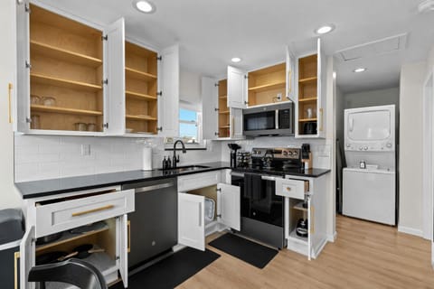 Modern, fully equipped kitchen with ample storage, sleek appliances, and clean finishes—perfect for cooking, meal prep, and easy everyday living.
