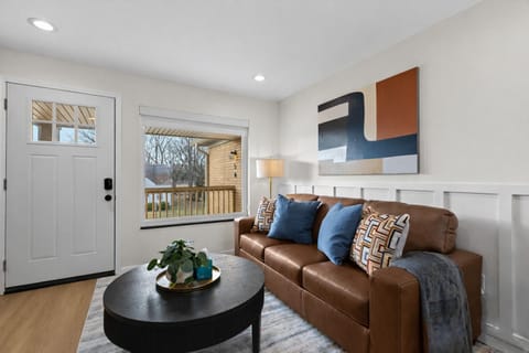 Warm, inviting living room with plush seating, modern décor, and natural light—perfect for relaxing after a day out or enjoying a cozy night in.