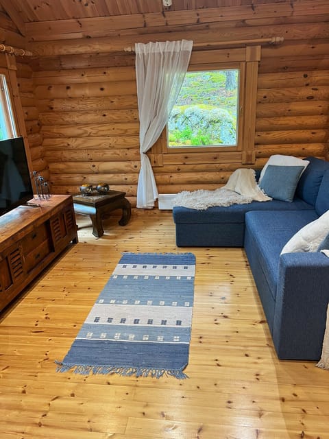 As evening falls, the cabin transforms into a cozy retreat—perfect for movie nights or curling up with a book.